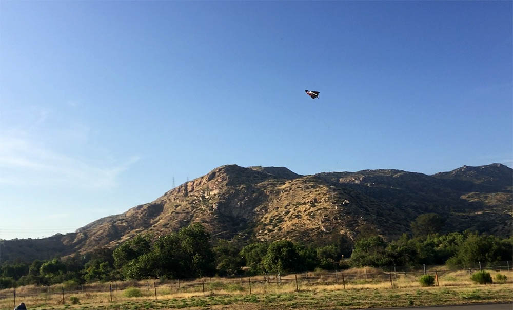 uav drone flies over mountains